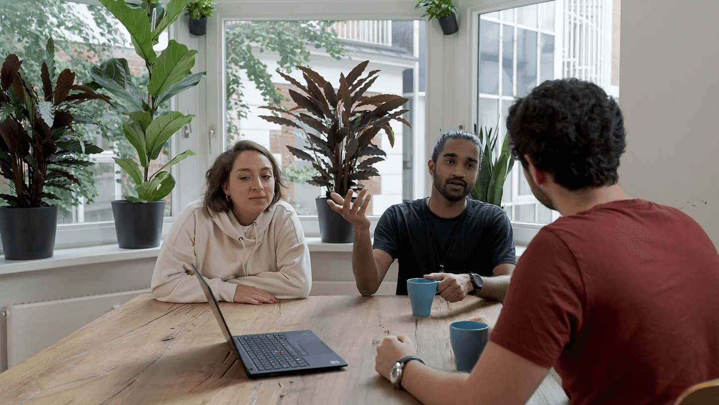 People talk at a table