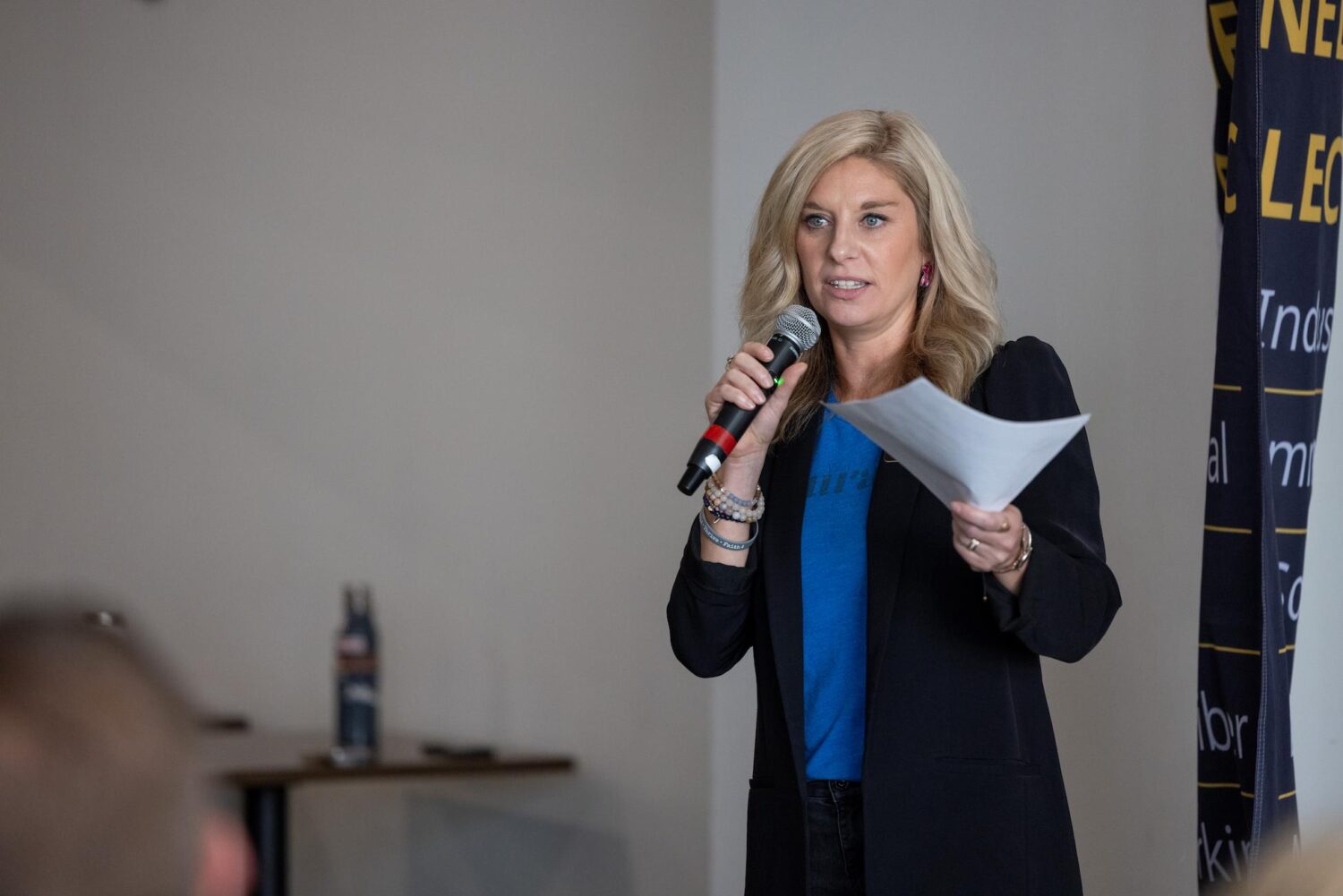 lindsay with microphone speaking to a group