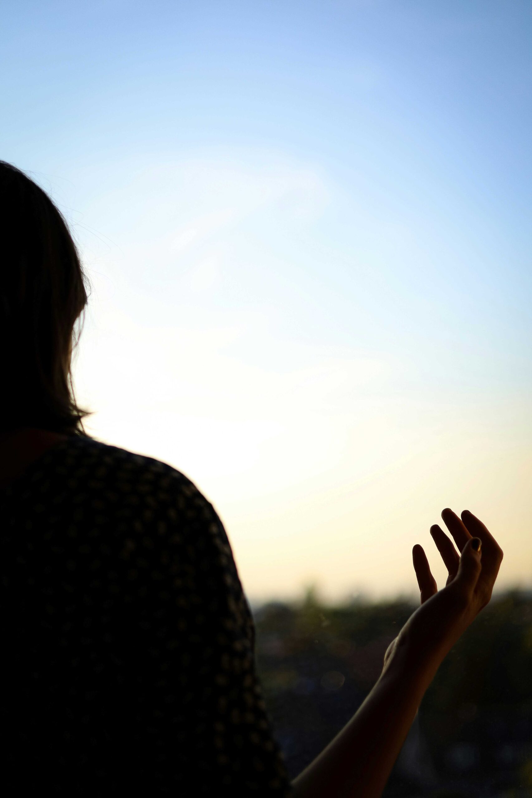 woman with hands in air